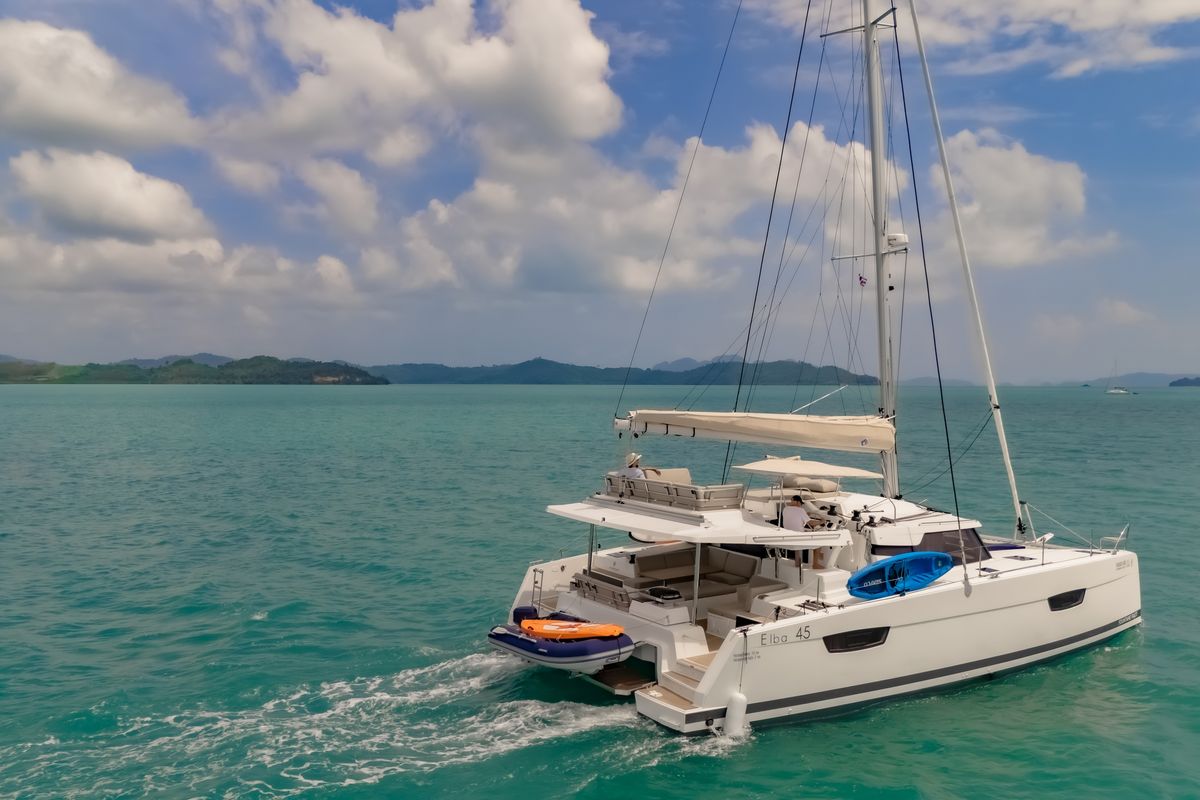 Exterior view of Chammak Challo, a Fountaine Pajot Elba 45 catamaran at Yacht Haven Marina, Thailand