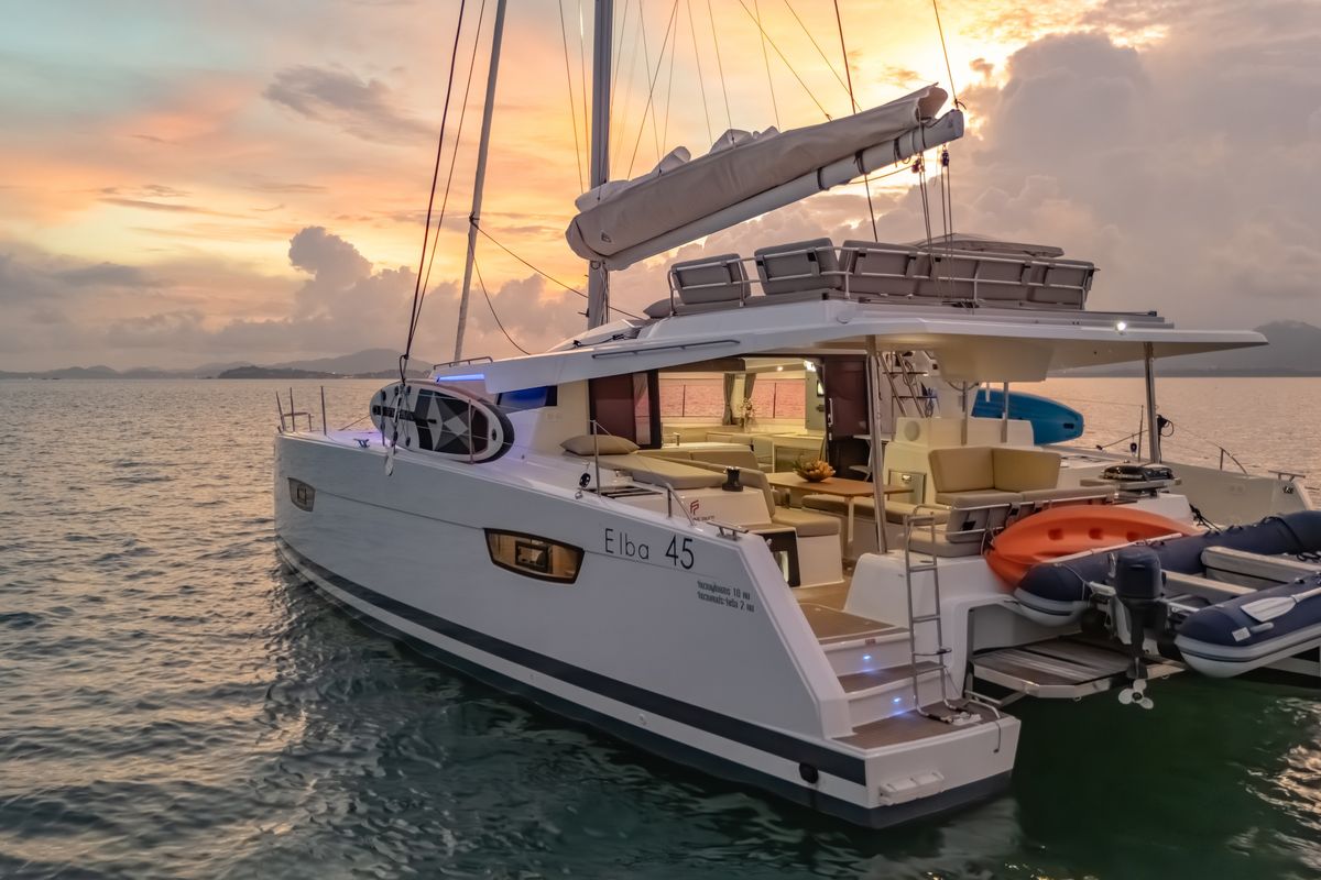 Exterior view of Chammak Challo, a Fountaine Pajot Elba 45 catamaran at Yacht Haven Marina, Thailand