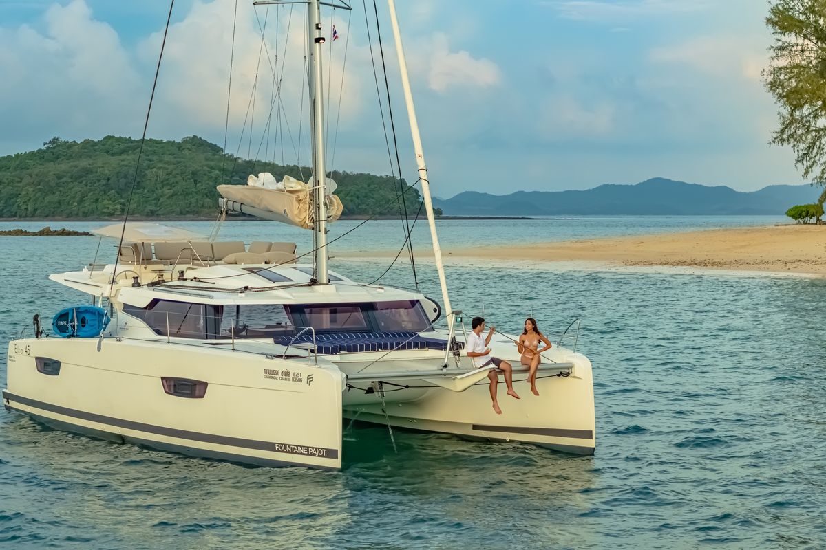 Exterior view of Chammak Challo, a Fountaine Pajot Elba 45 catamaran at Yacht Haven Marina, Thailand