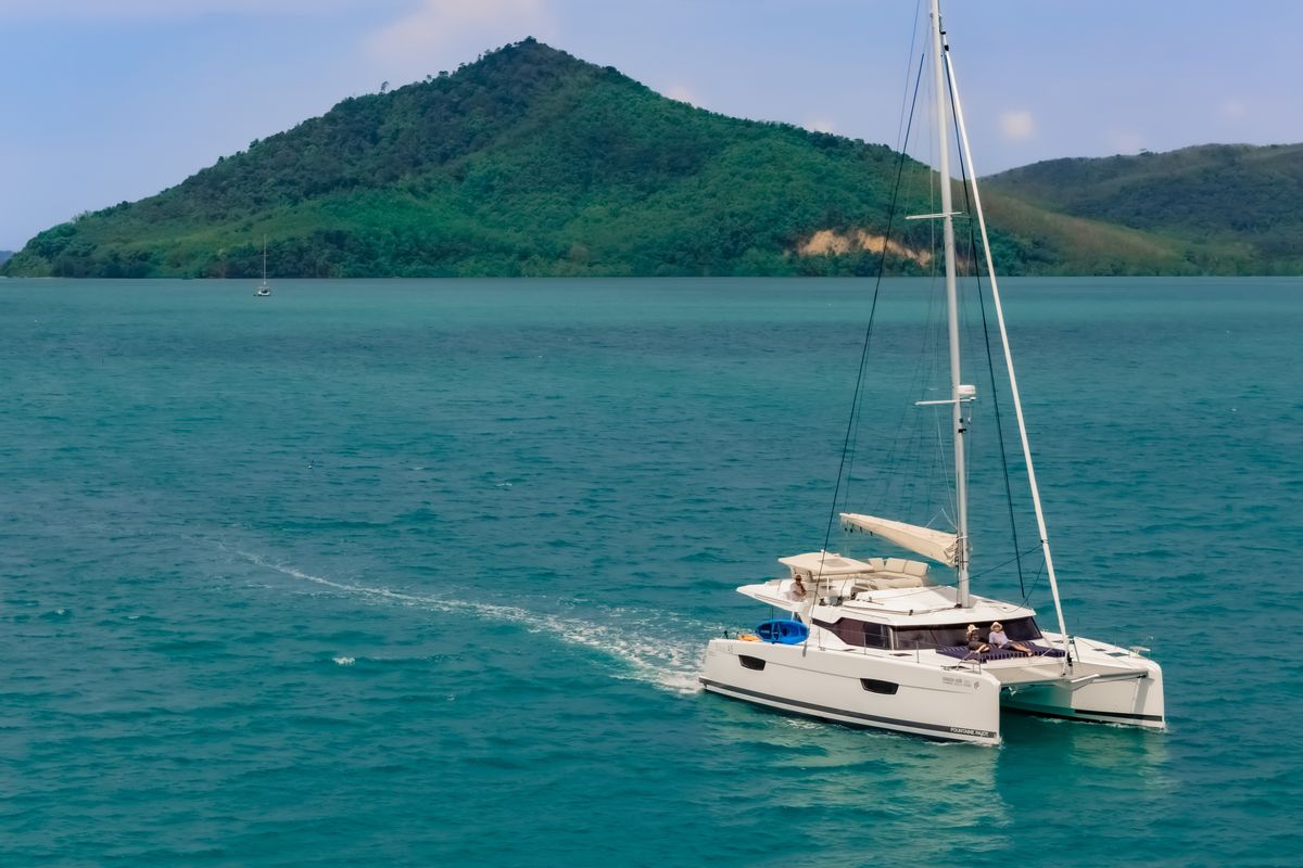 Exterior view of Chammak Challo, a Fountaine Pajot Elba 45 catamaran at Yacht Haven Marina, Thailand