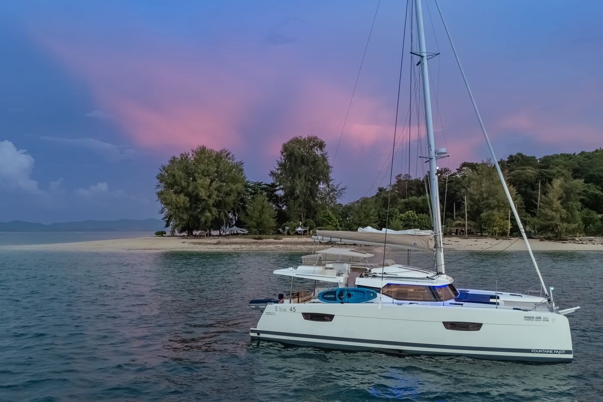 Exterior view of Chammak Challo, a Fountaine Pajot Elba 45 catamaran at Yacht Haven Marina, Thailand