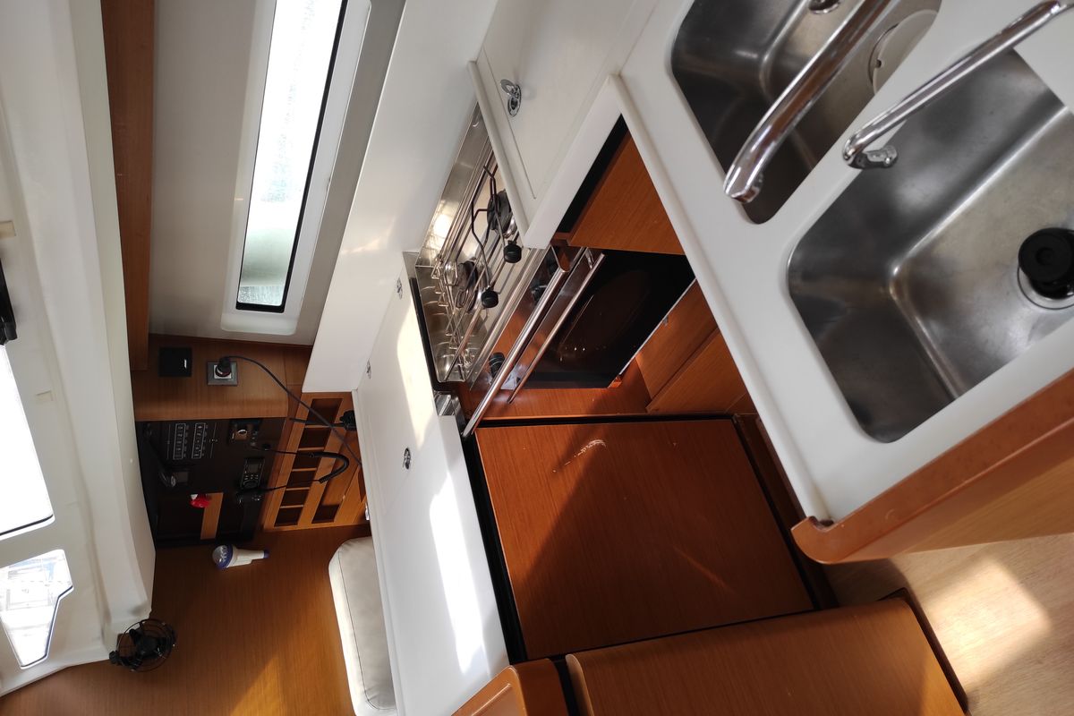Galley of Alboran Caipiroska, a Jeanneau Sun Odyssey 440 sailboat at es Jonquet, Spain
