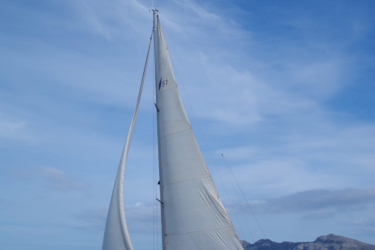 Exterior view of Papaya, a Bavaria 51 Cruiser sailboat at Port de Pollença, Spain