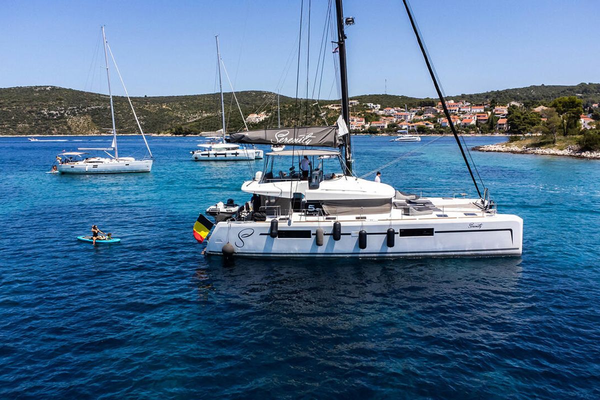 Exterior view of Serenity, a Lagoon 52 catamaran at Grad Kaštela, Croatia