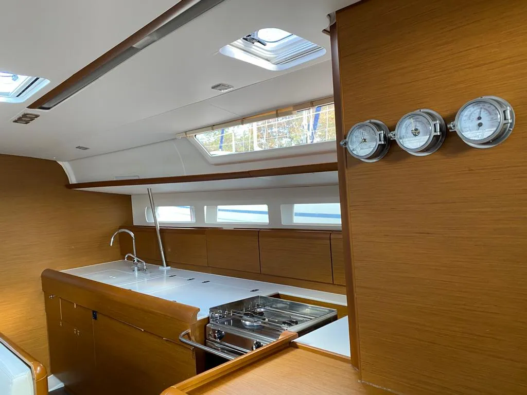 Galley of Alboran Pacharan (Majorca), a Jeanneau Sun Odyssey 519 sailboat at es Jonquet, Spain
