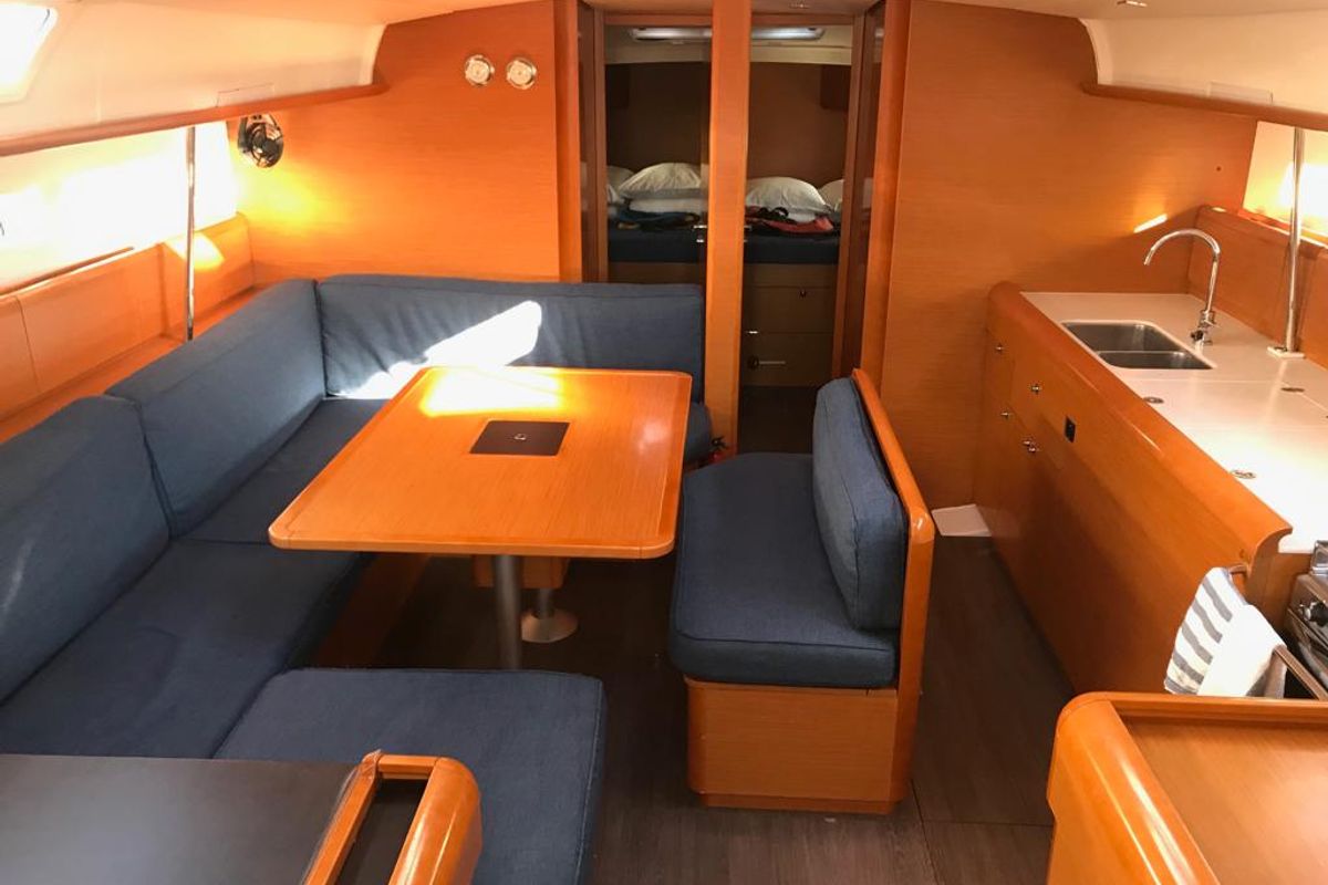 Salon of Alboran Bourbon, a Jeanneau Sun Odyssey 519 sailboat at es Jonquet, Spain