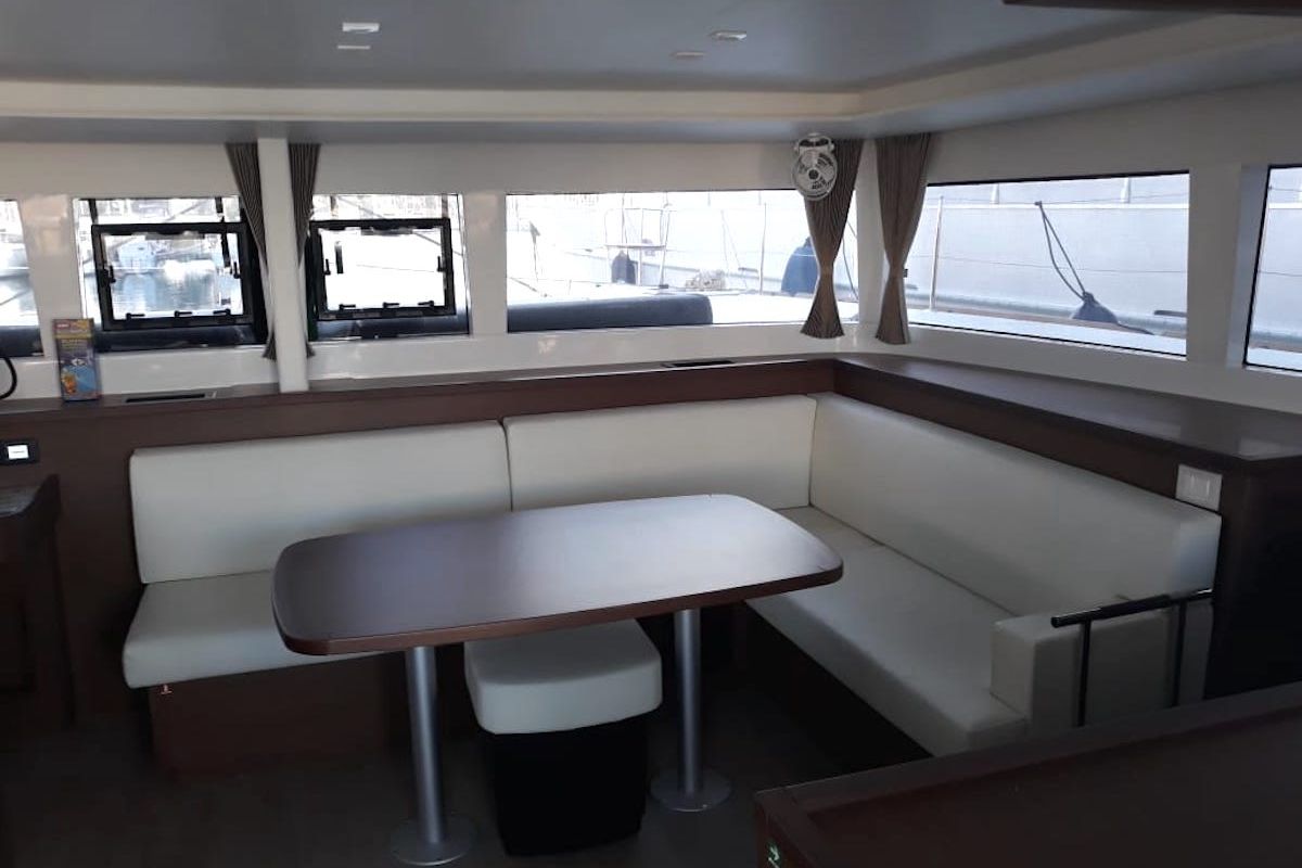 Salon of Escapade, a Lagoon 450 Fly catamaran at Athens, Greece