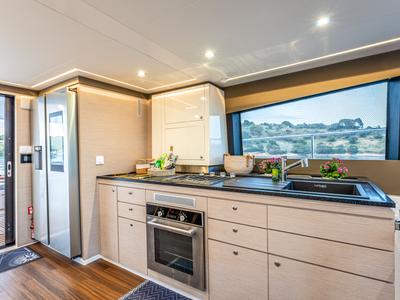 Galley of Nyd'amour II, a Aventura Catamarans Aventura 14 Power catamaran at Municipal Unit of Kranidi, Greece