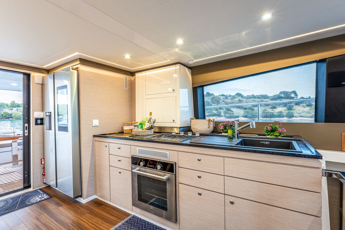 Galley of Nyd'amour II, a Aventura Catamarans Aventura 14 Power catamaran at Municipal Unit of Kranidi, Greece