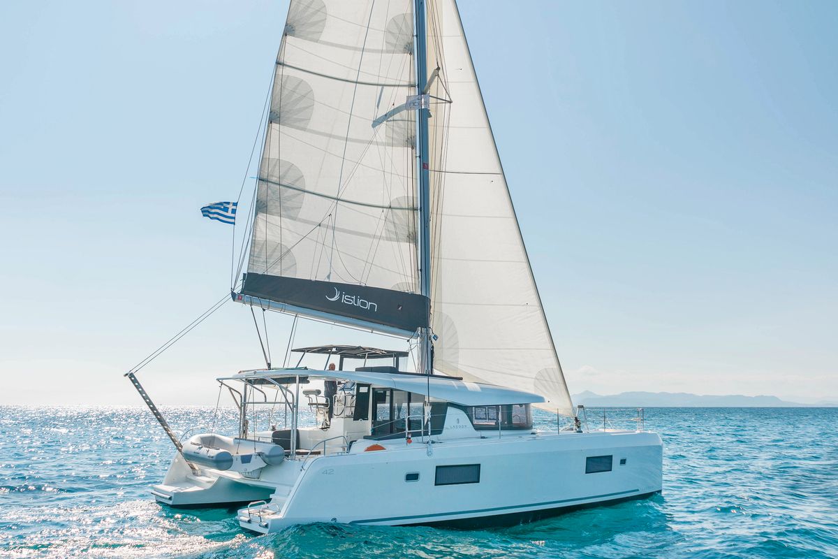 Exterior view of Wind Whisper, a Lagoon 42 catamaran at Parikia, Greece