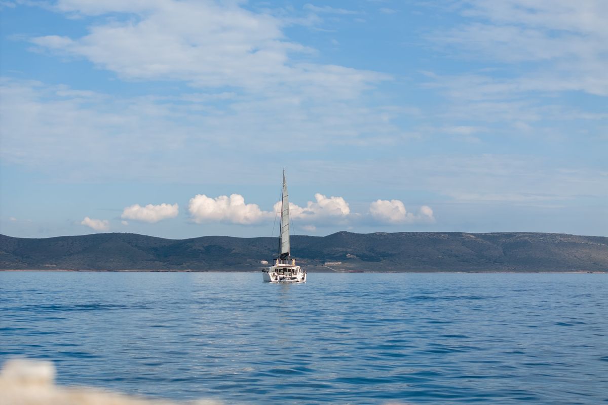 Exterior view of MADICON, a Lagoon 450 Fly catamaran at Thira Municipal Unit, Greece
