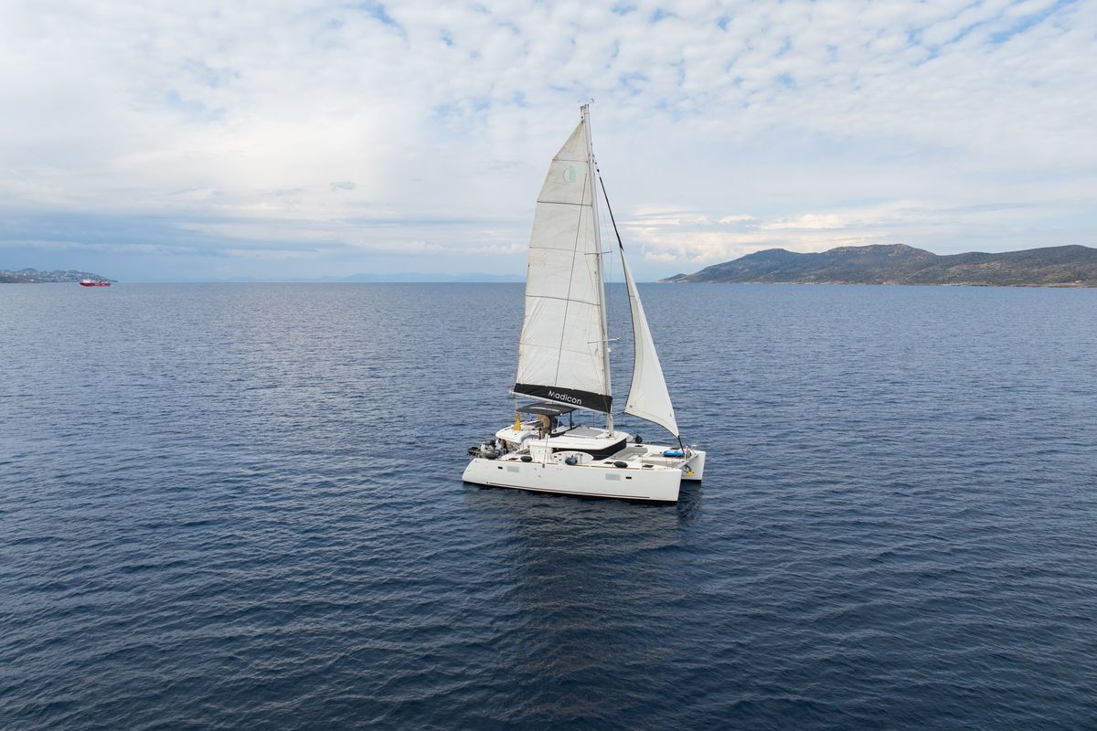 Exterior view of MADICON, a Lagoon 450 Fly catamaran at Thira Municipal Unit, Greece