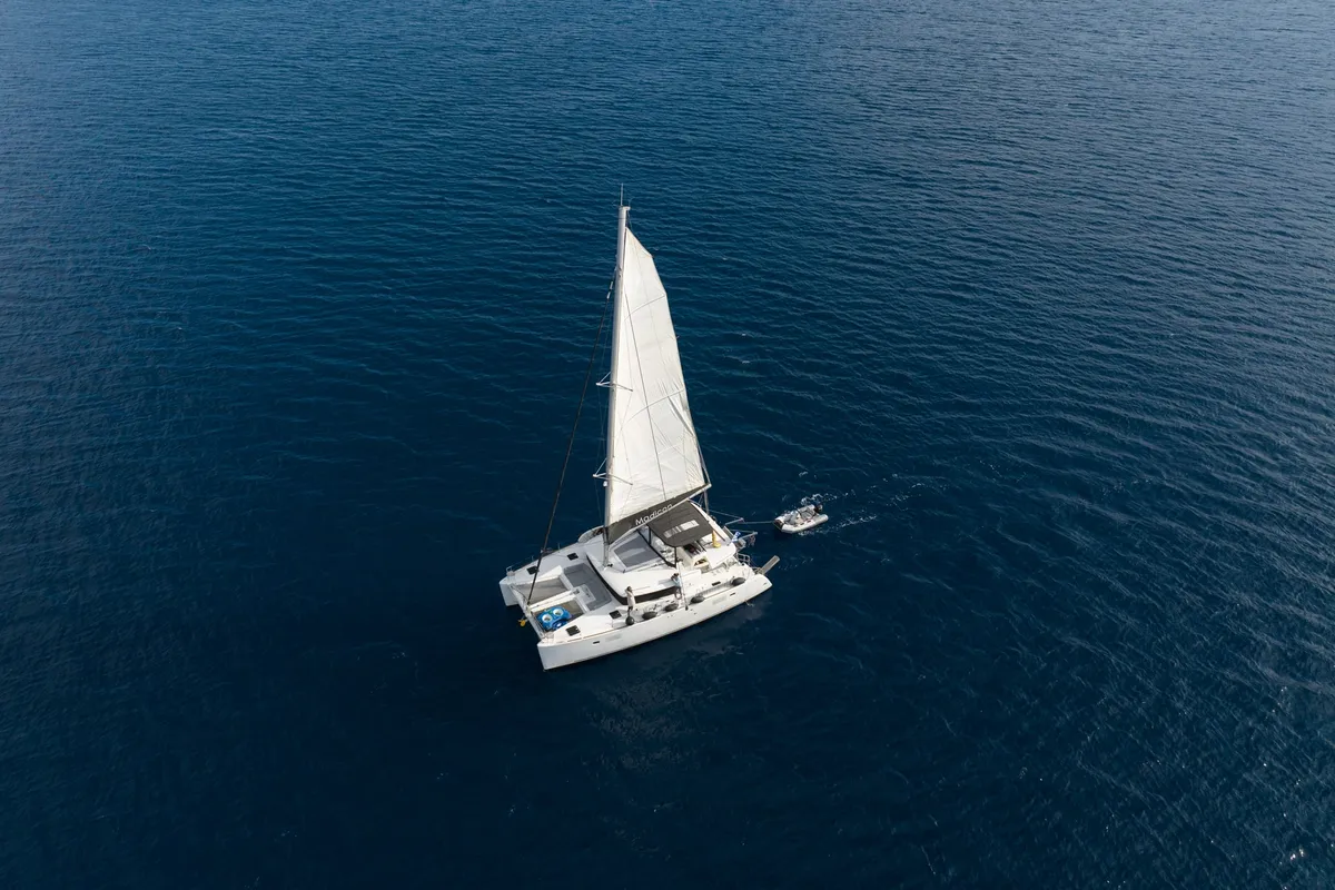 Exterior view of MADICON, a Lagoon 450 Fly catamaran at Thira Municipal Unit, Greece