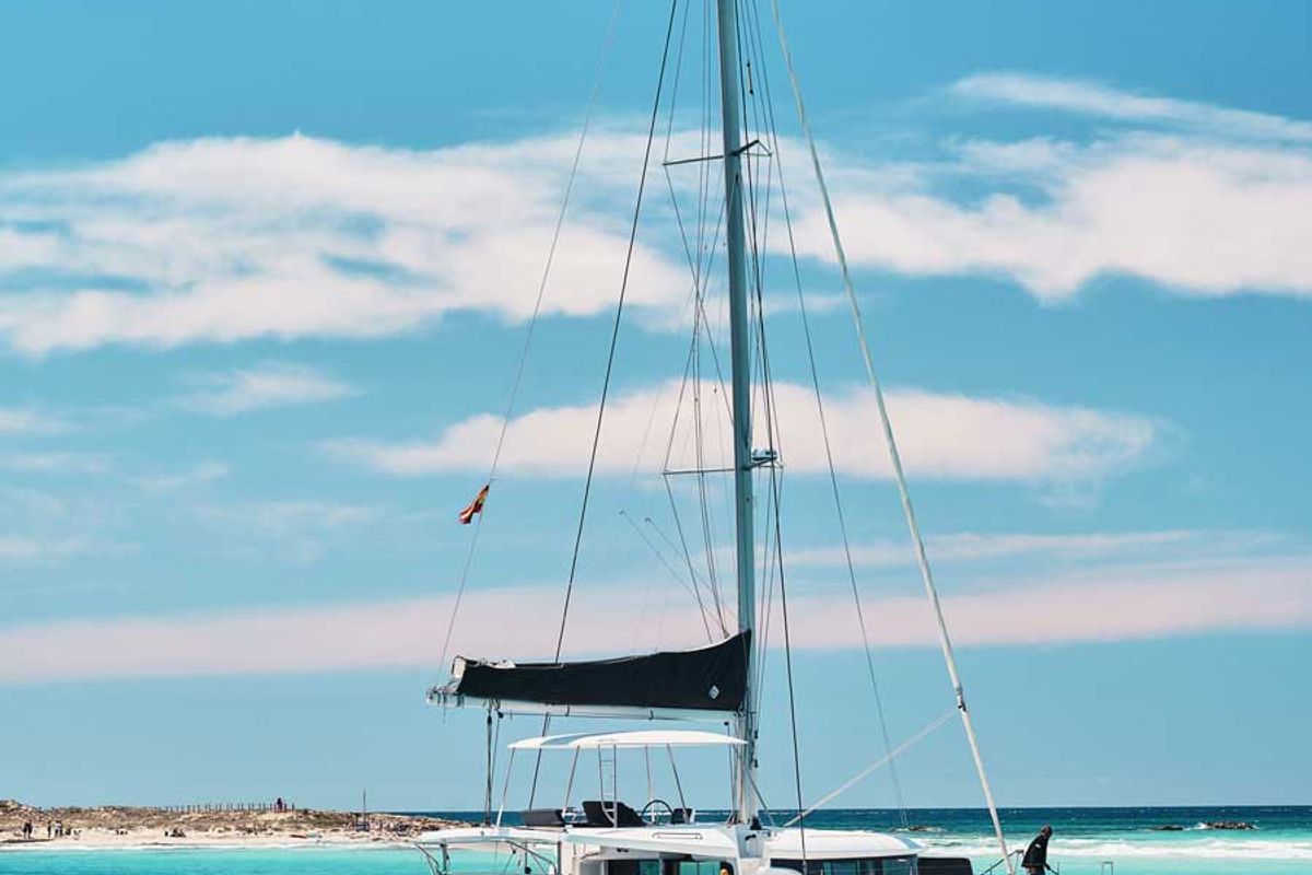 Exterior view of Invalid, a Lagoon 46 catamaran at Sant Antoni de Portmany, Spain
