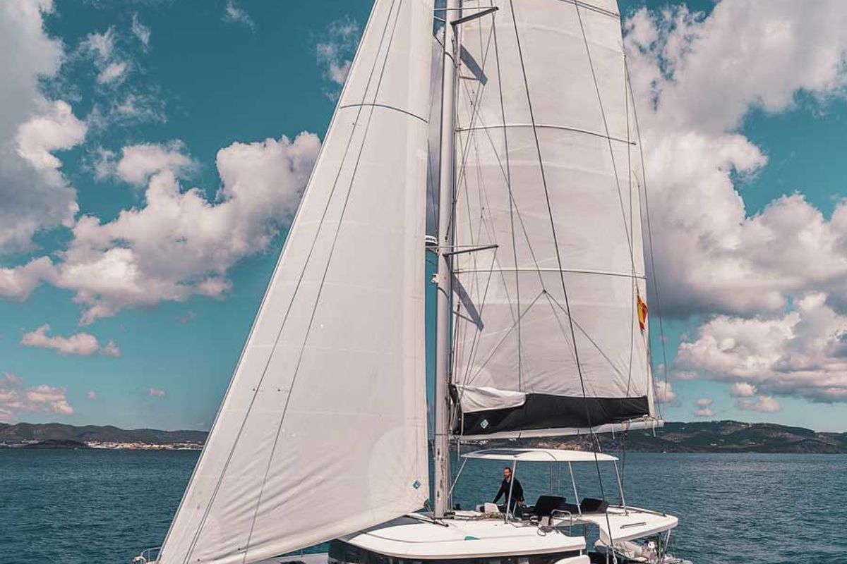 Exterior view of Invalid, a Lagoon 46 catamaran at Sant Antoni de Portmany, Spain