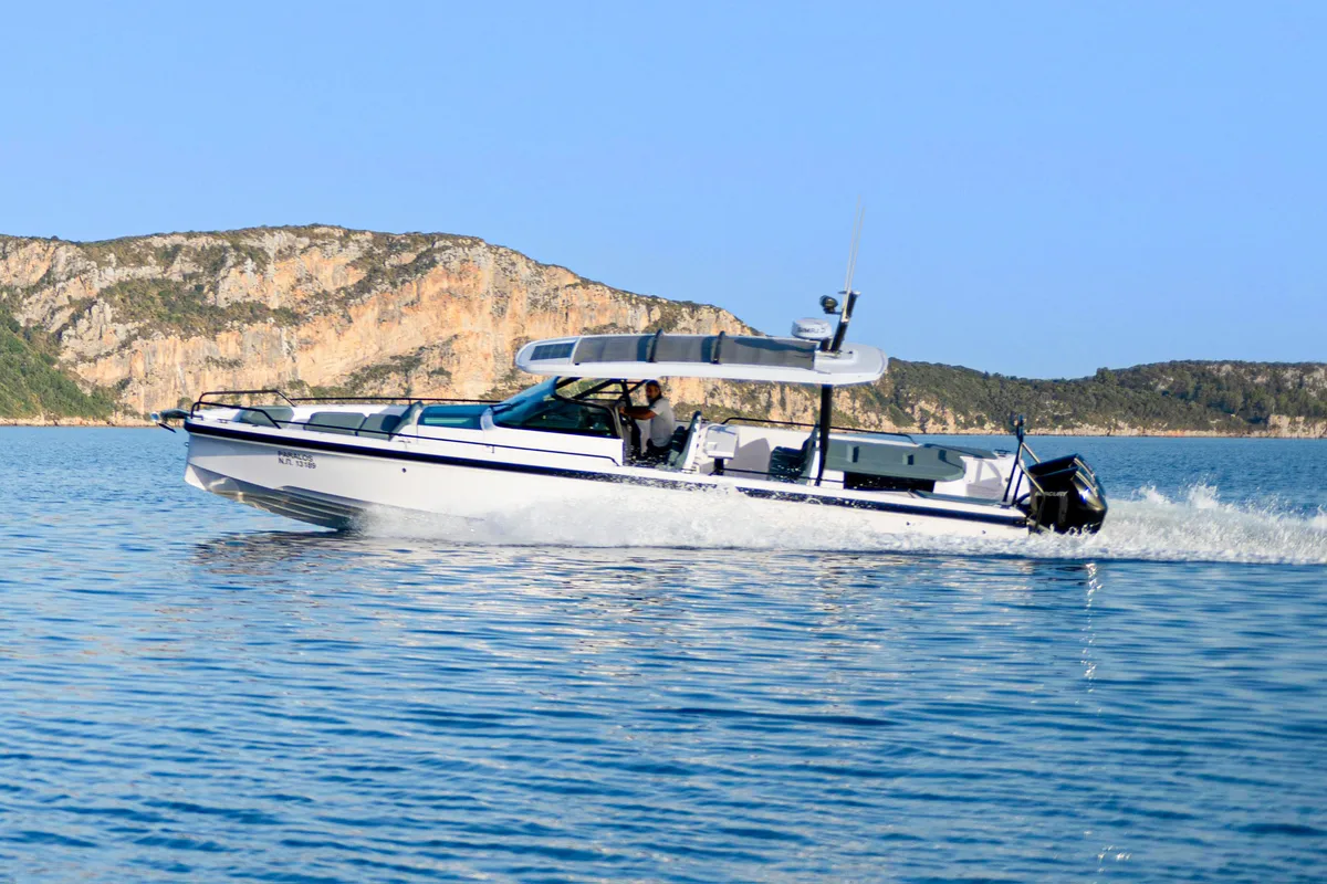 Exterior view of PARALOS, a Axopar 37  Sun Top motorboat at Lavreotiki Municipal Unit, Greece