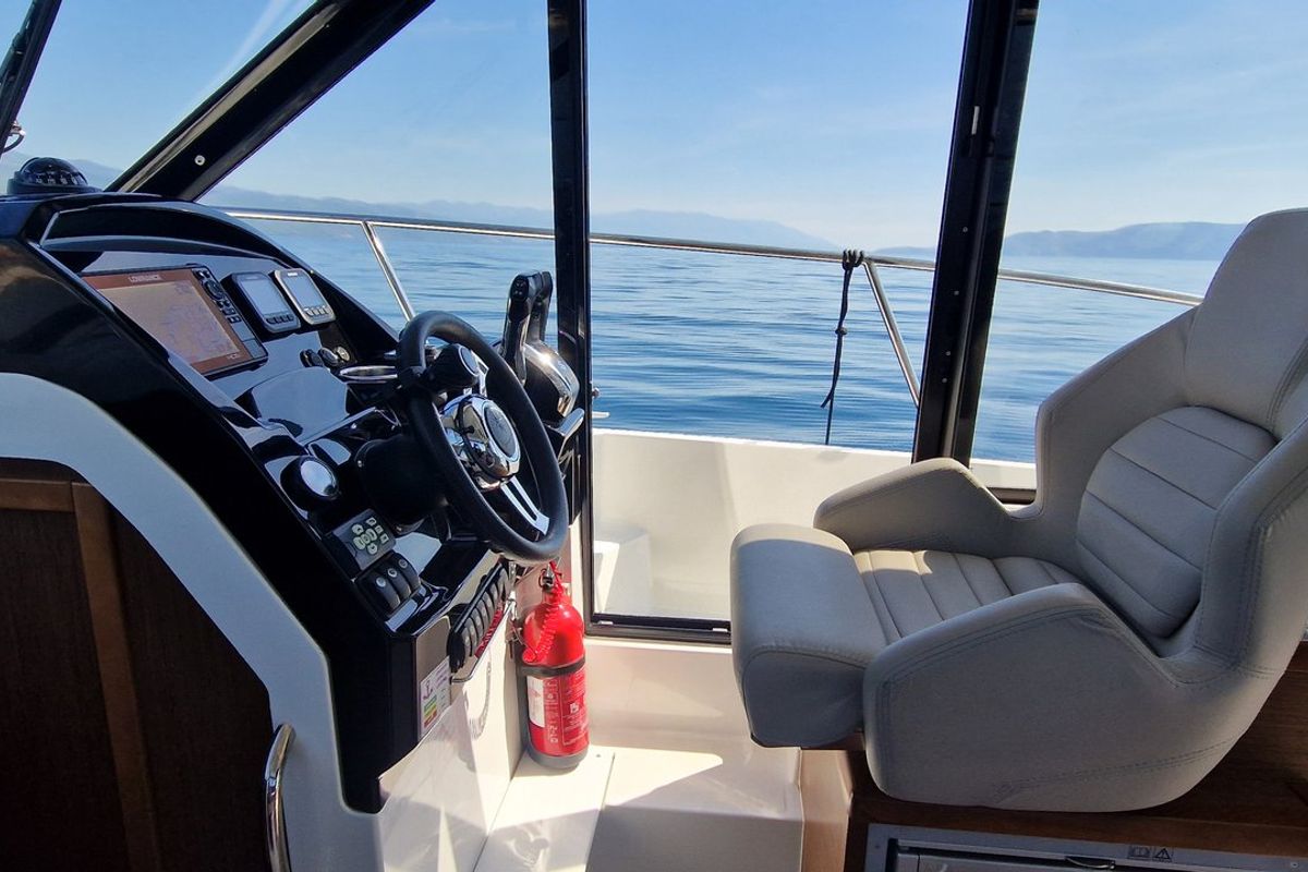 Cockpit of Whiskey, a Jeanneau Merry Fisher 895 motorboat at Novi Vinodolski, Croatia