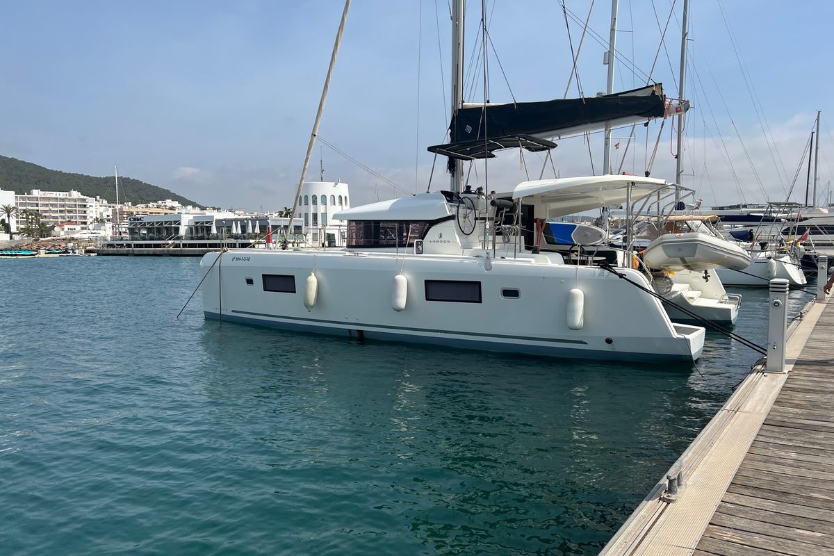 Exterior view of Genista II, a Lagoon 42 catamaran at Sant Antoni de Portmany, Spain