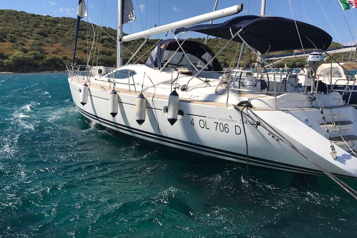 Exterior view of Cassiopea II, a Jeanneau Sun Odyssey 54DS sailboat at Olbia, Italy