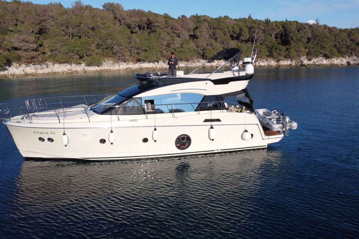 Exterior view of Sundowner, a Beneteau Monte Carlo 5 motorboat at Grad Trogir, Croatia