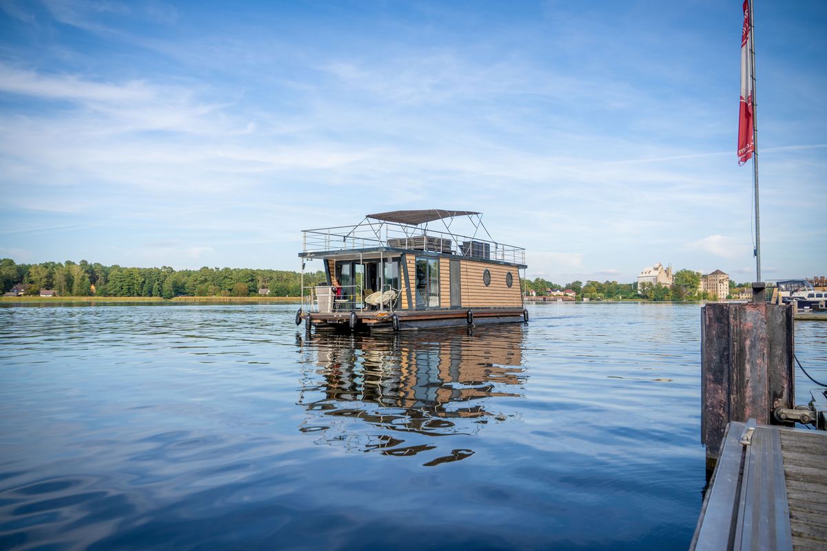 Exterior view of Miami, a Woma D13 motorboat at Fürstenberg/Havel, Germany