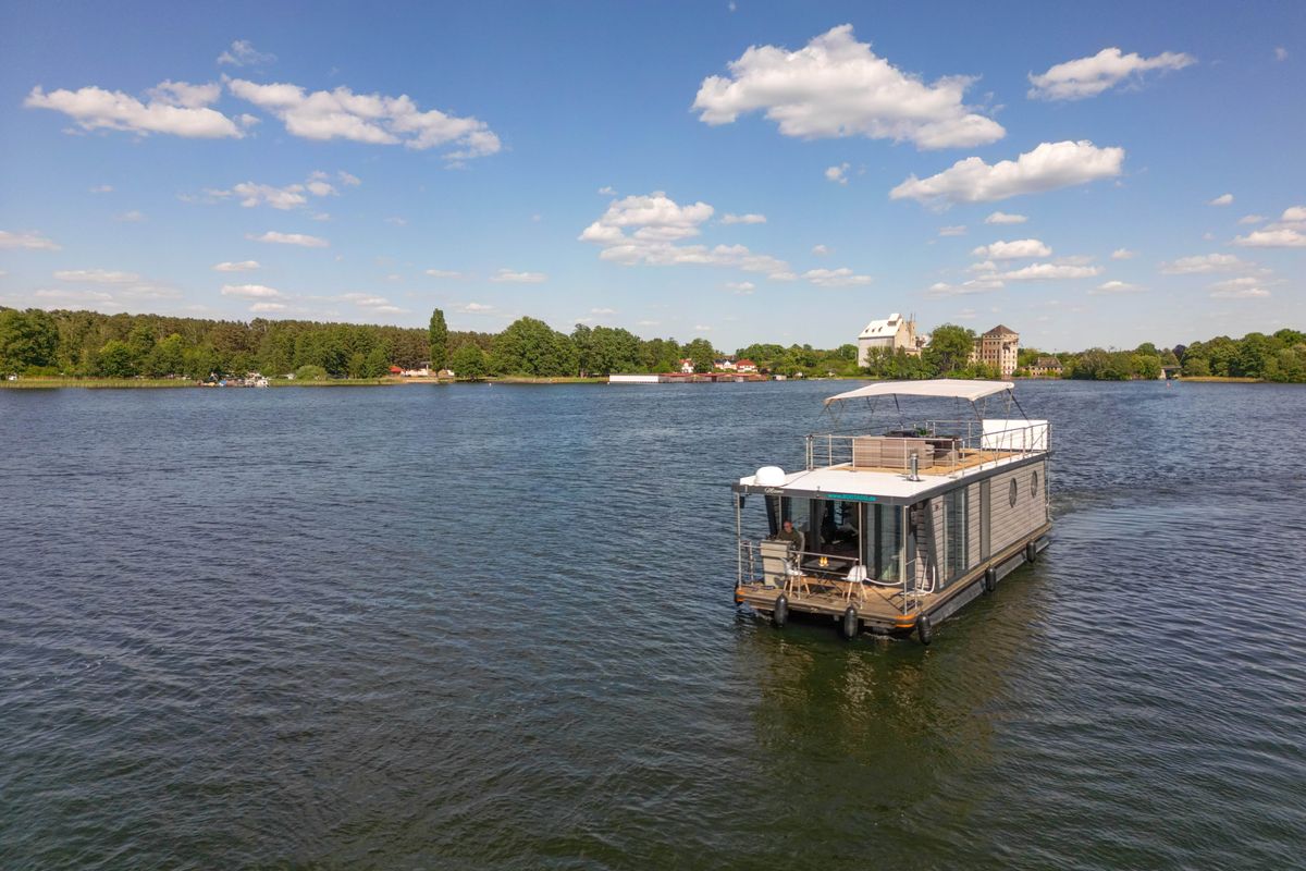 Exterior view of Miami, a Woma D13 motorboat at Fürstenberg/Havel, Germany