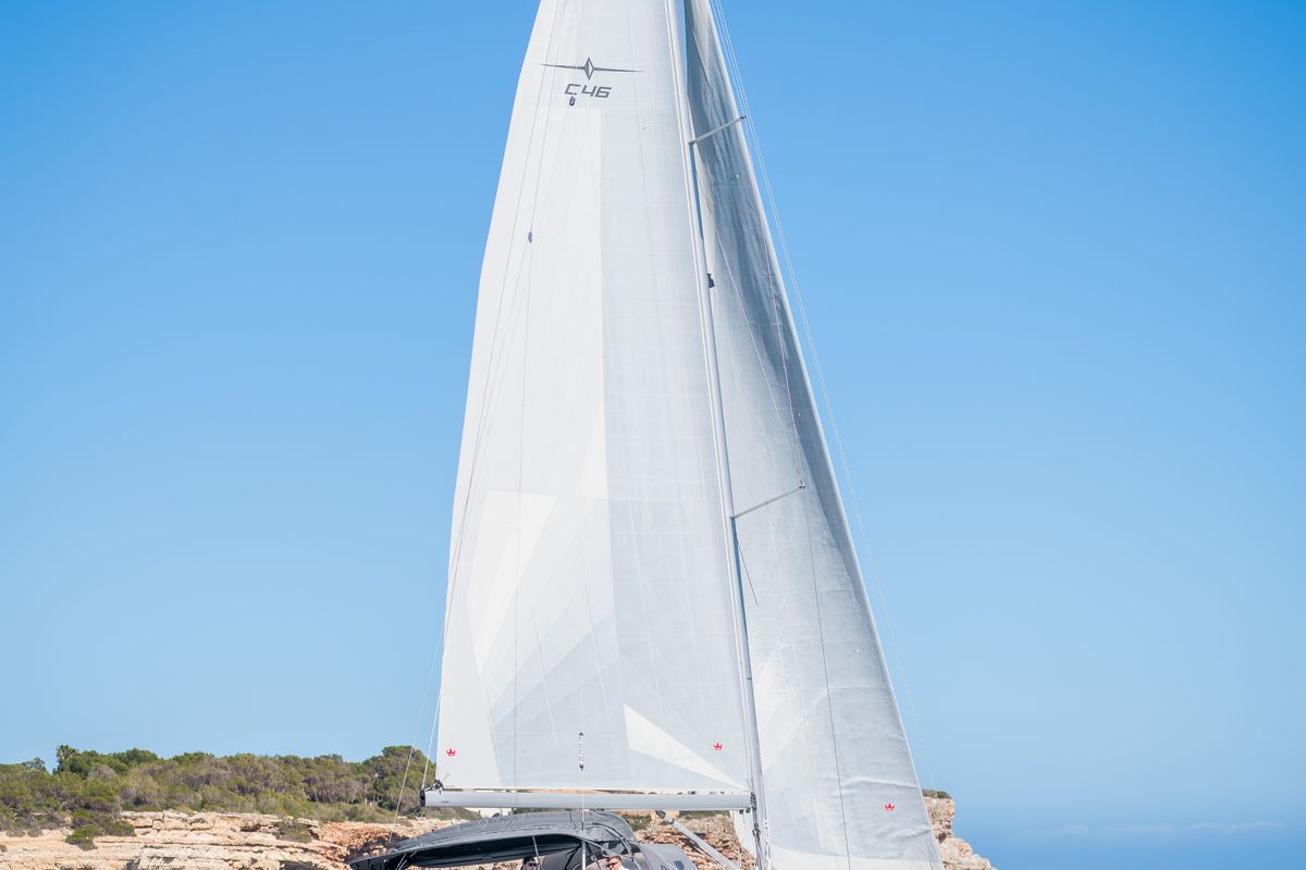 Exterior view of Ostwind III, a Bavaria C46 sailboat at Cala Egos, Spain