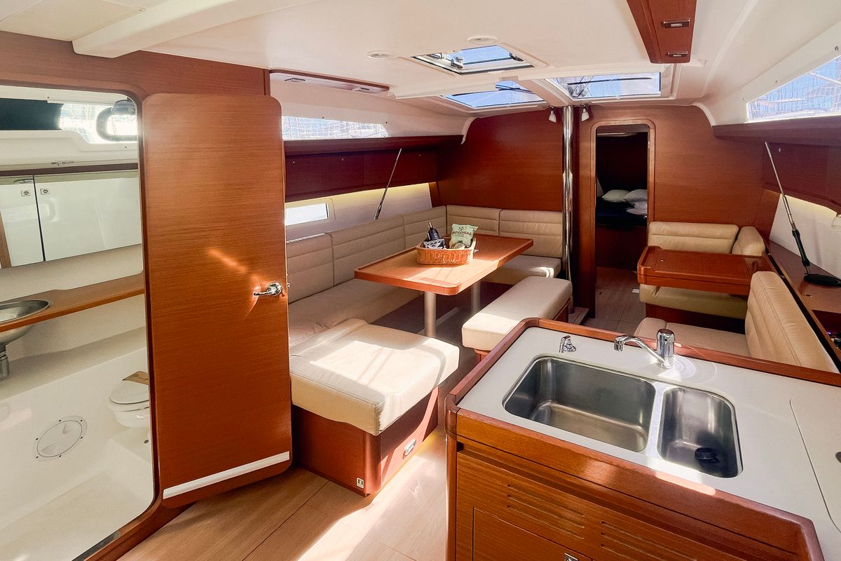 Salon of Domi, a Dufour 412 Grand large sailboat at Olbia, Italy