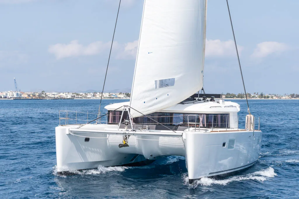 Exterior view of Oneno, a Lagoon 450 Fly catamaran at Sant Antoni de Portmany, Spain