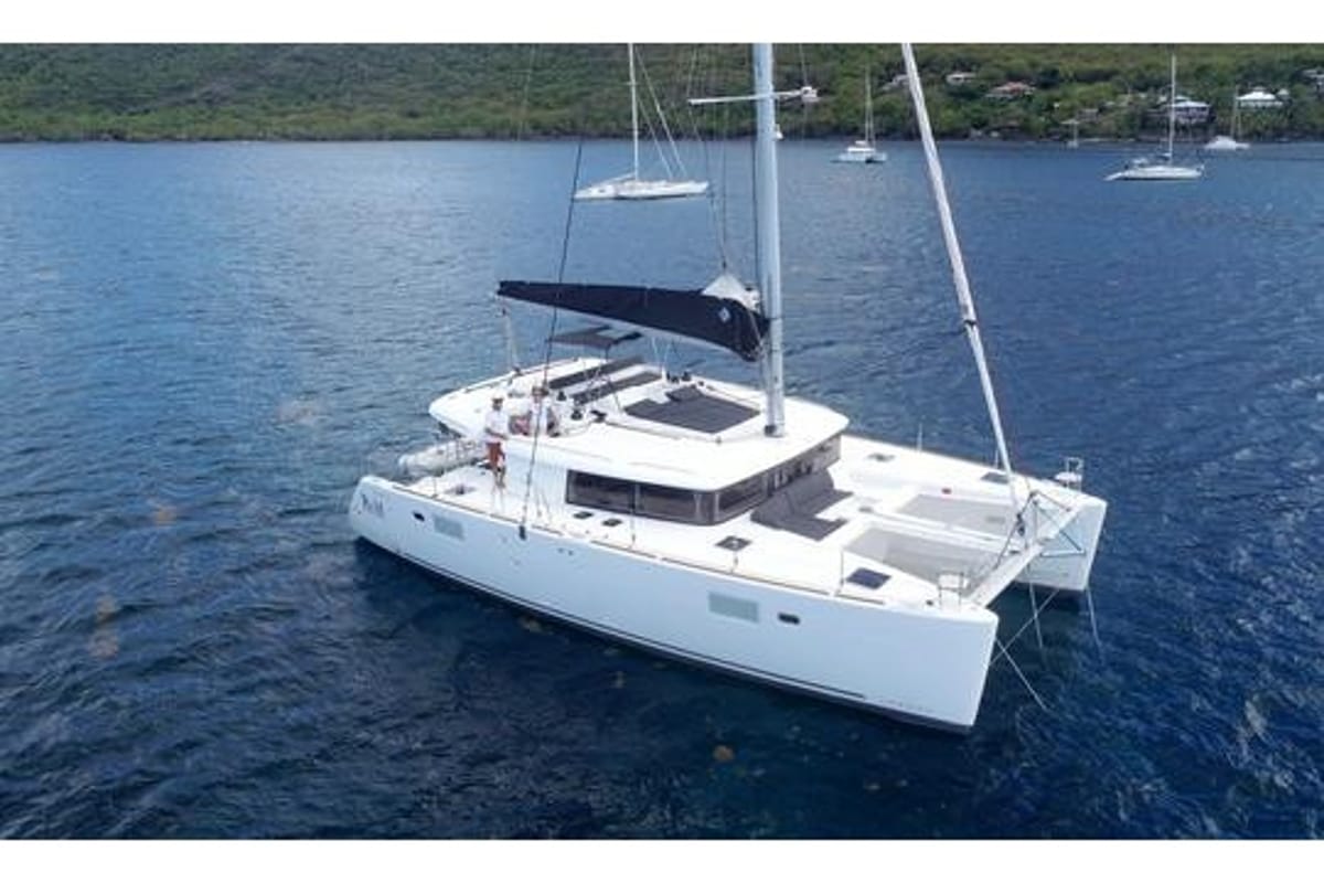 Exterior view of Oneno, a Lagoon 450 Fly catamaran at Sant Antoni de Portmany, Spain
