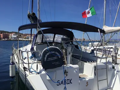 Exterior view of Sabik, a Beneteau Oceanis 393 sailboat at U Pàize/Carloforte, Italy