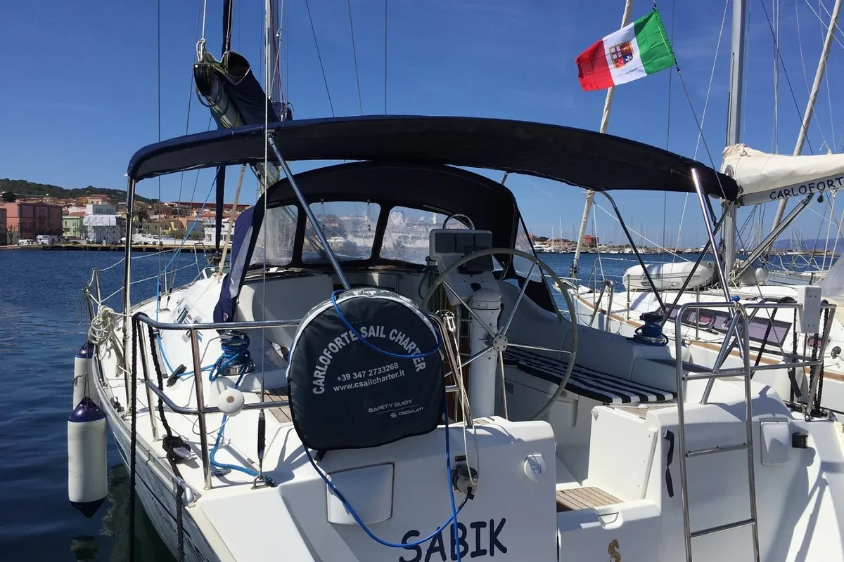 Exterior view of Sabik, a Beneteau Oceanis 393 sailboat at U Pàize/Carloforte, Italy