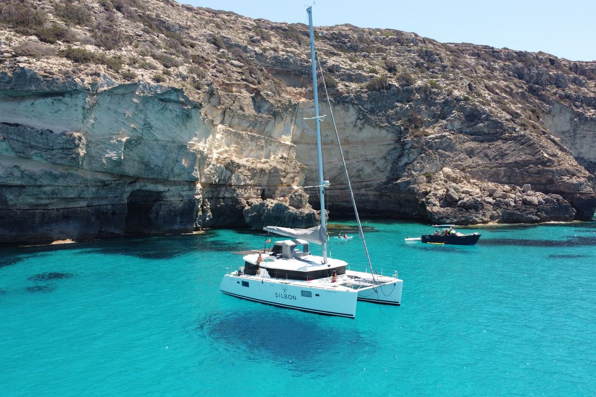 Exterior view of Gran Azul, a Lagoon 450 catamaran at Santa Eulària des Riu, Spain