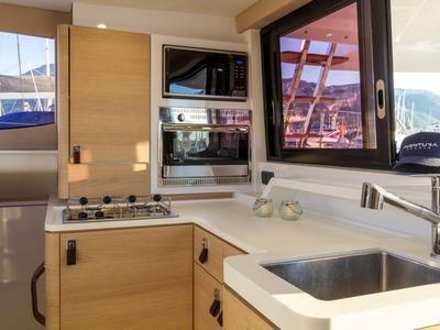 Galley of Flor de Ibiza, a Aventura Catamarans Aventura 37 catamaran at Dénia, Spain