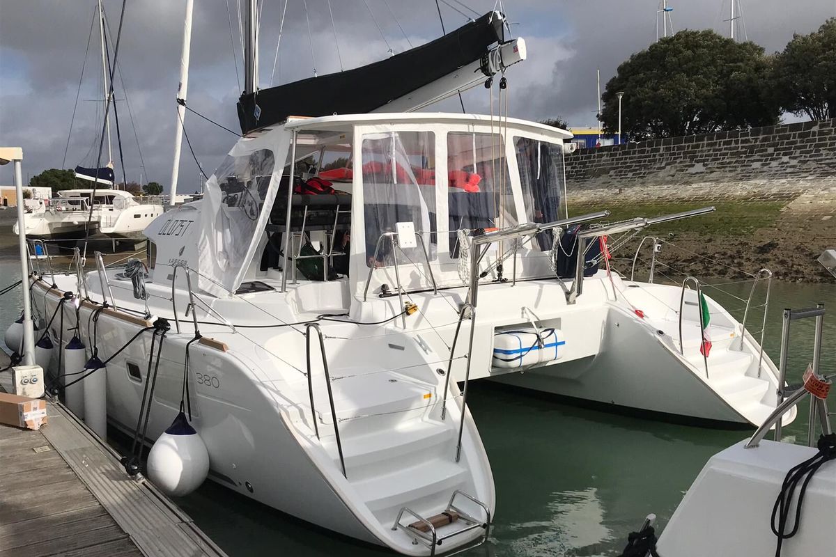 Exterior view of Naos, a Lagoon 380 catamaran at Olbia, Italy