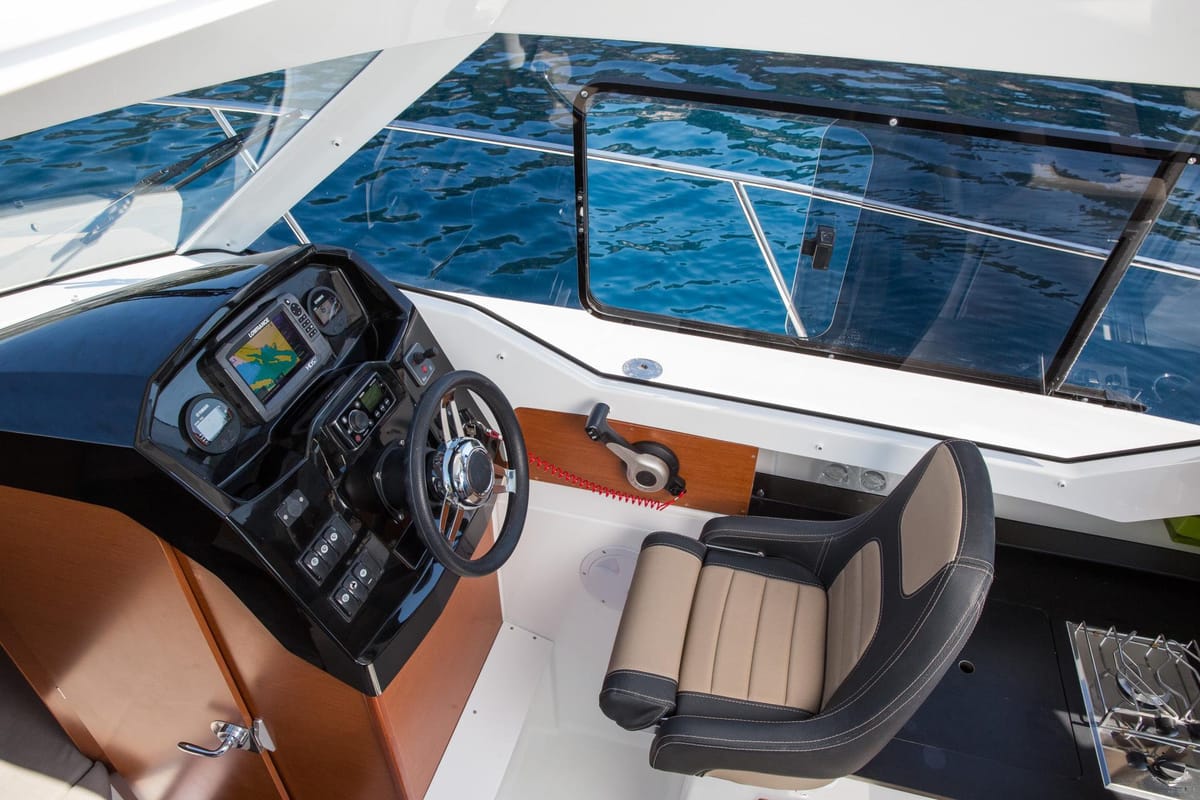 Cockpit of Merry Fisher 795, a Jeanneau Merry Fisher 795 motorboat at Grad Trogir, Croatia