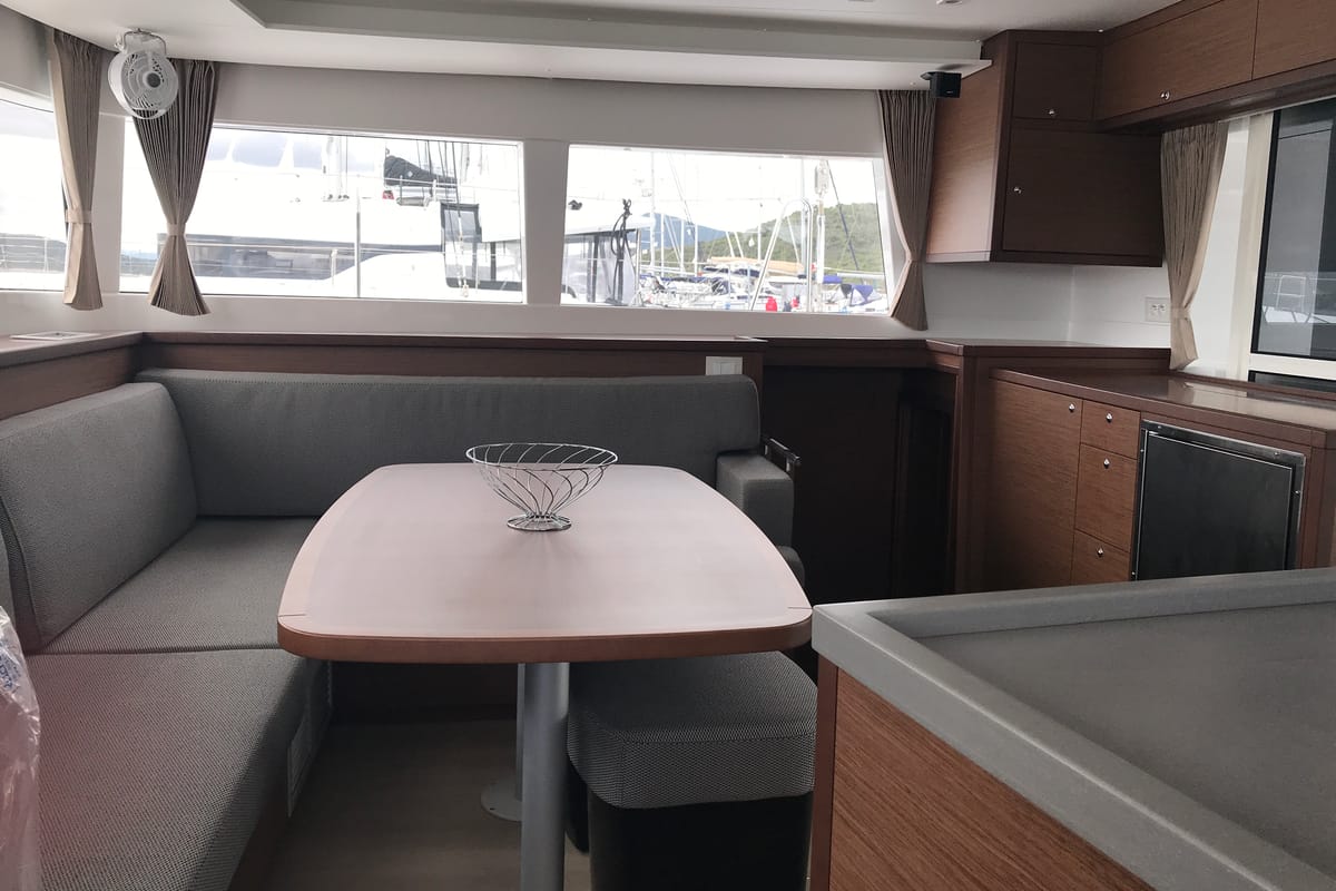 Salon of Rigel Kentaurus, a Lagoon 450 Fly catamaran at Olbia, Italy