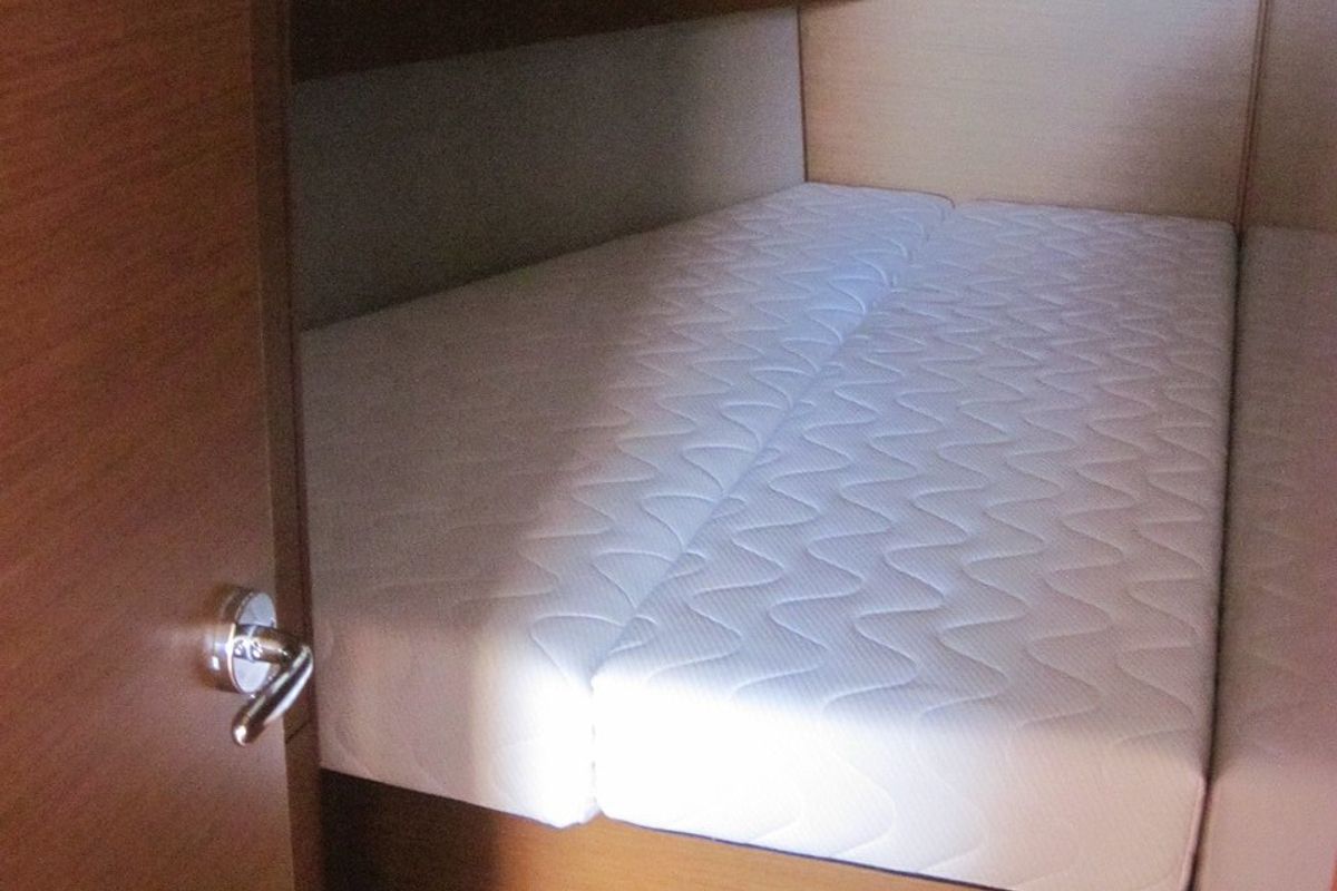 Cabin on Erminia, a Jeanneau Sun Odyssey 440 sailboat at Capo d'Orlando, Italy