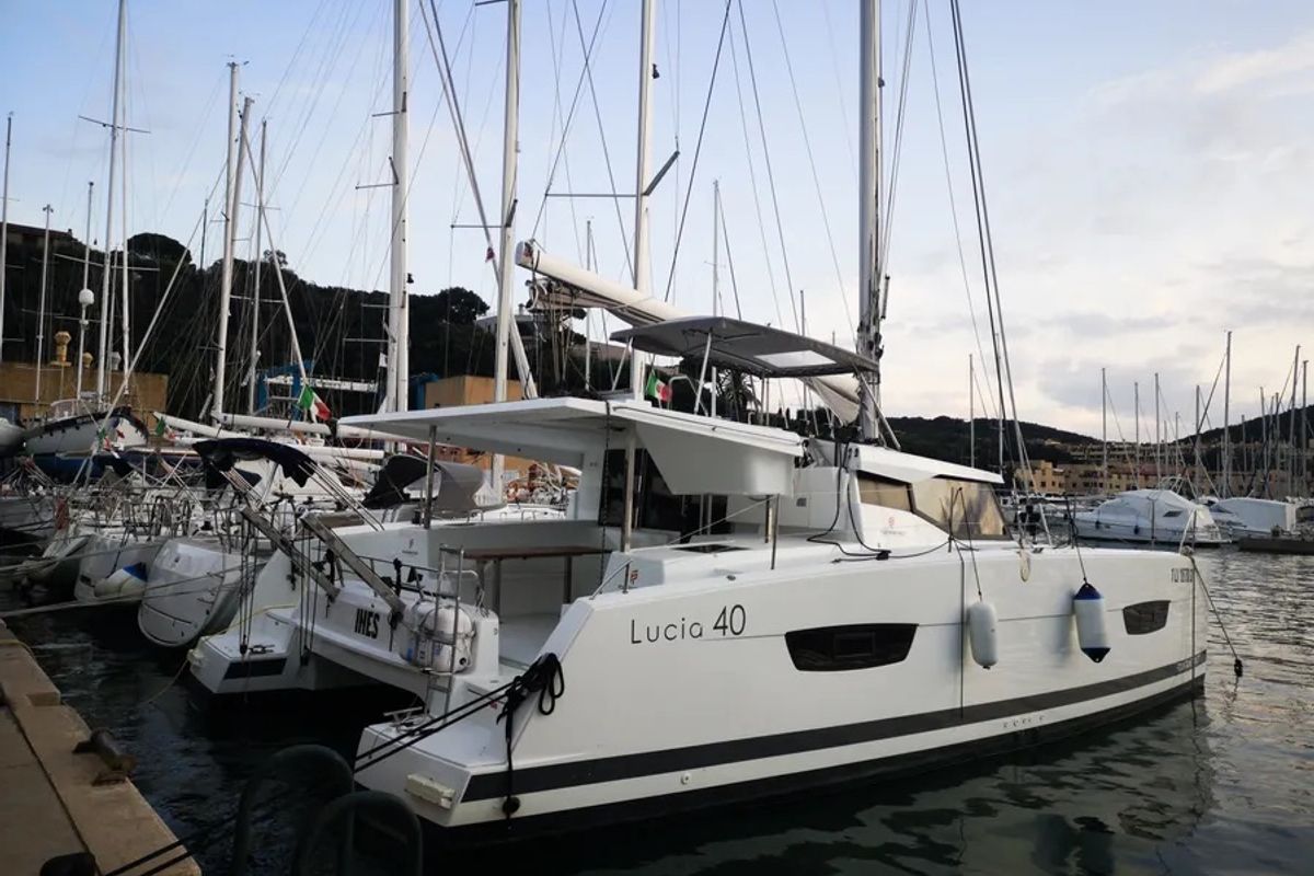 Exterior view of Ines, a Fountaine Pajot Lucia 40 catamaran at Olbia, Italy