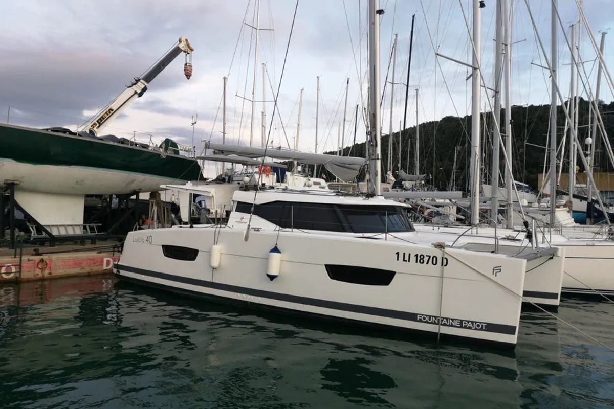 Exterior view of Ines, a Fountaine Pajot Lucia 40 catamaran at Olbia, Italy