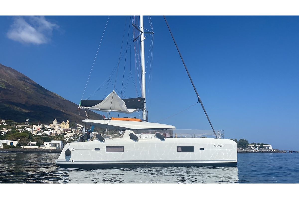 Exterior view of MAGAN 1 WATER MAKER - PANNELS , a Lagoon 42 catamaran at Capo d'Orlando, Italy