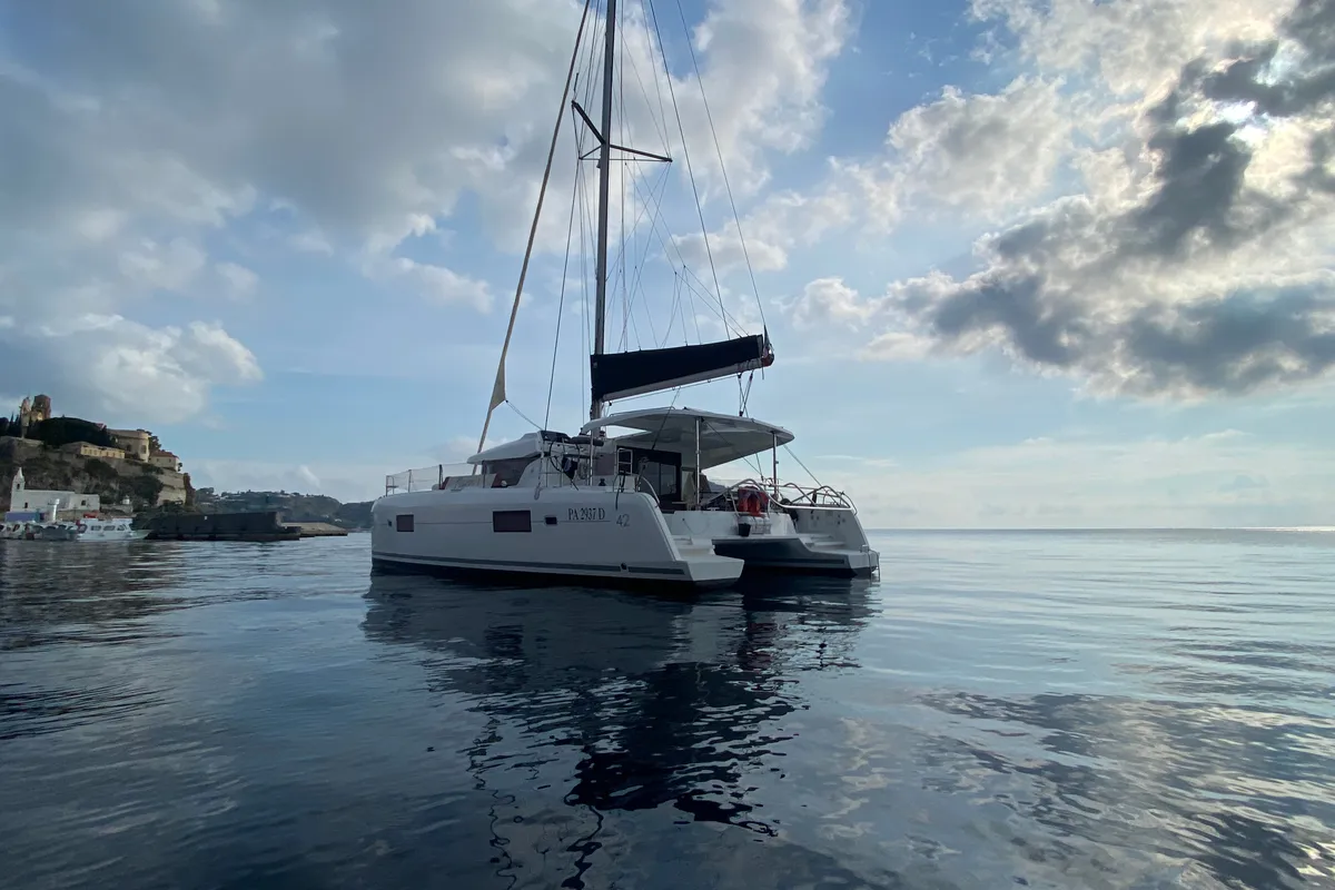 Exterior view of MAGAN 1 WATER MAKER - PANNELS , a Lagoon 42 catamaran at Capo d'Orlando, Italy
