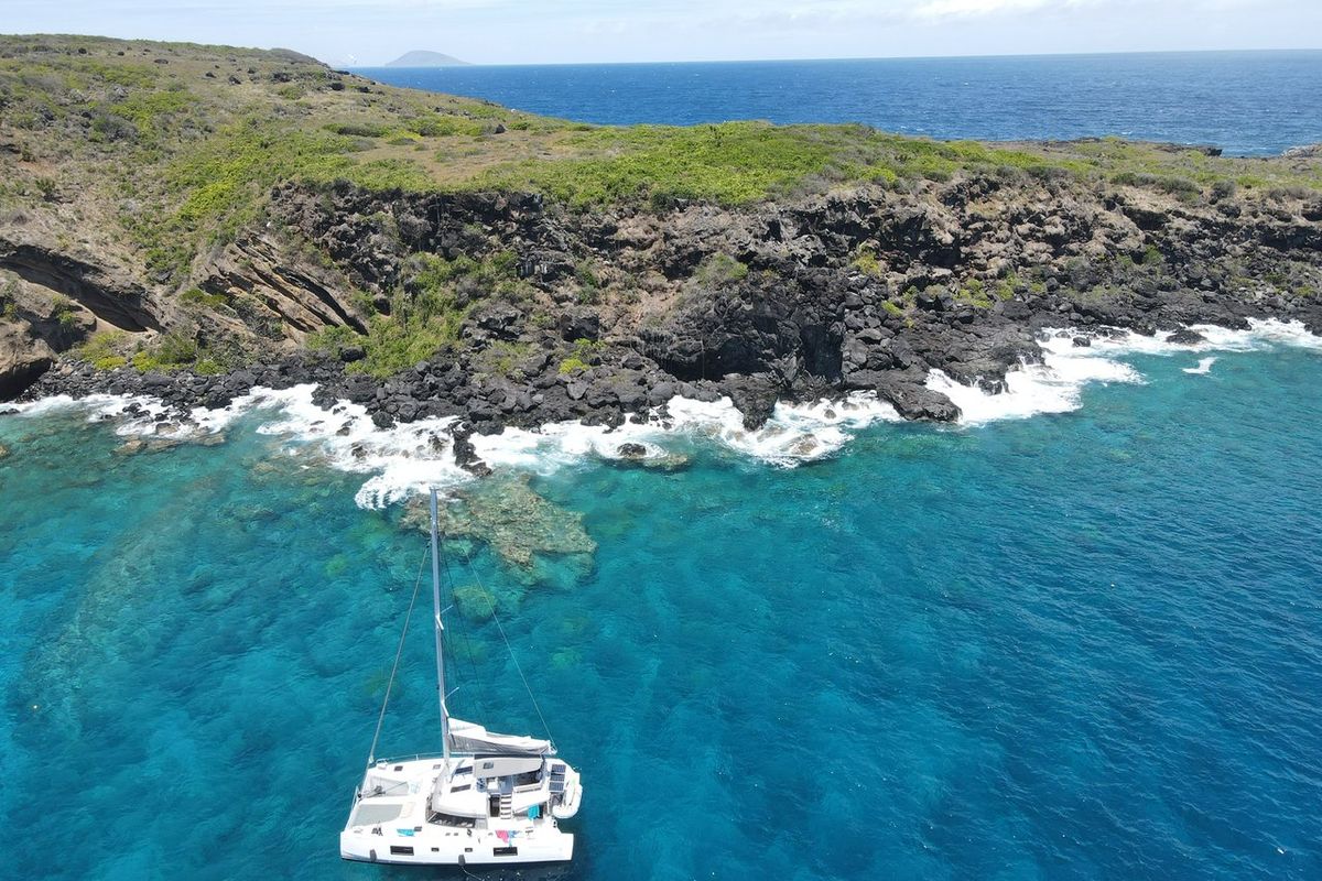 Exterior view of Sea Spirit II, a Nautitech Rochefort Nautitech 46 Fly catamaran at Grande Rivière Noire VCA, Mauritius