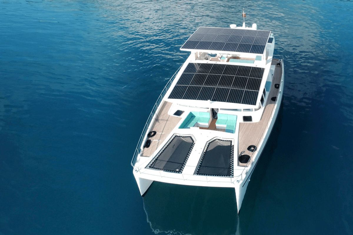 Exterior view of Premium +, a Gulet Serenity 64 catamaran at Sant Antoni de Portmany, Spain