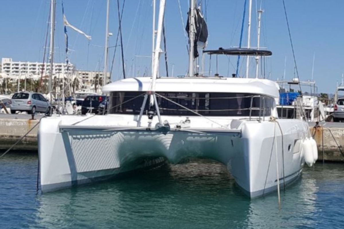 Exterior view of Mares, a Lagoon 42 catamaran at Sant Antoni de Portmany, Spain