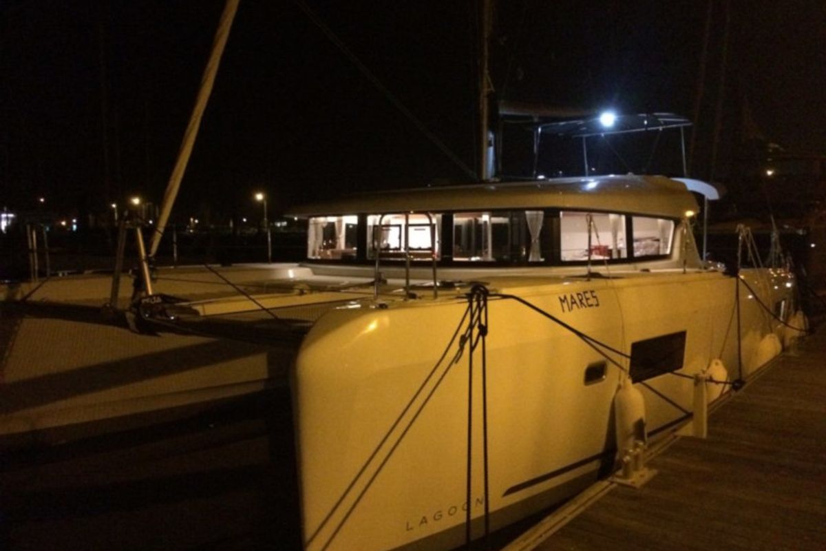 Exterior view of Mares, a Lagoon 42 catamaran at Sant Antoni de Portmany, Spain