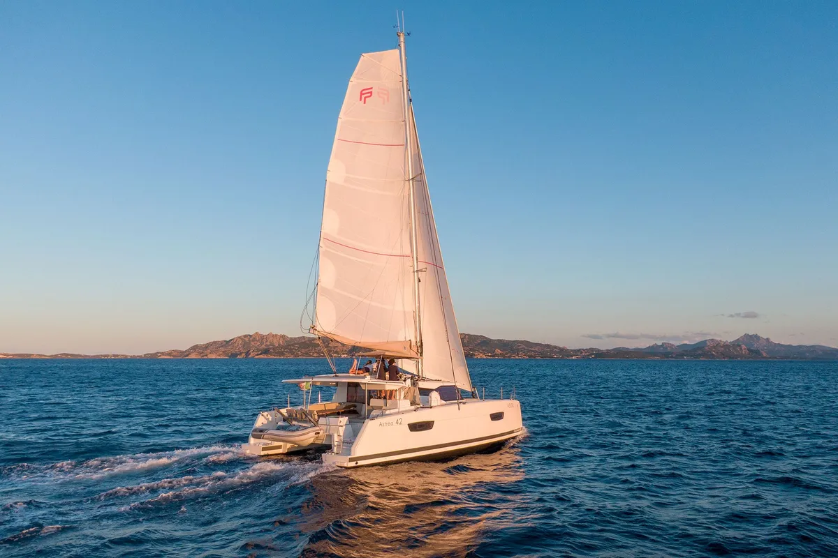Exterior view of Agitation - A/C, Generator, Water maker. Solar panel, a Fountaine Pajot Astréa 42 catamaran at Cannigione,…