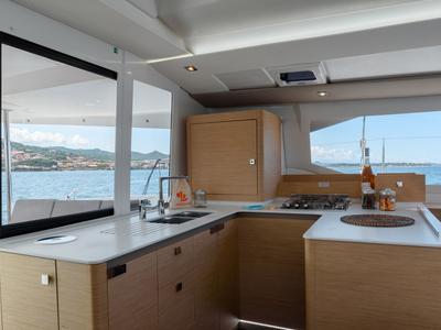 Galley of Agitation - A/C, Generator, Water maker. Solar panel, a Fountaine Pajot Astréa 42 catamaran at Cannigione, Italy