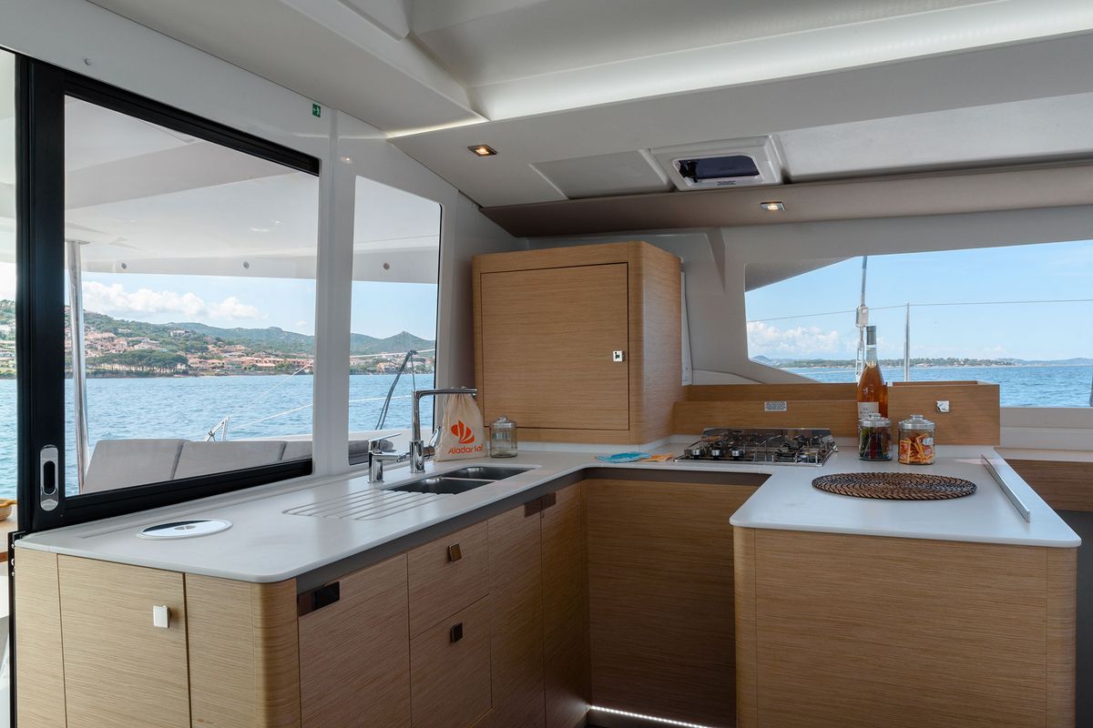 Galley of Agitation - A/C, Generator, Water maker. Solar panel, a Fountaine Pajot Astréa 42 catamaran at Cannigione, Italy