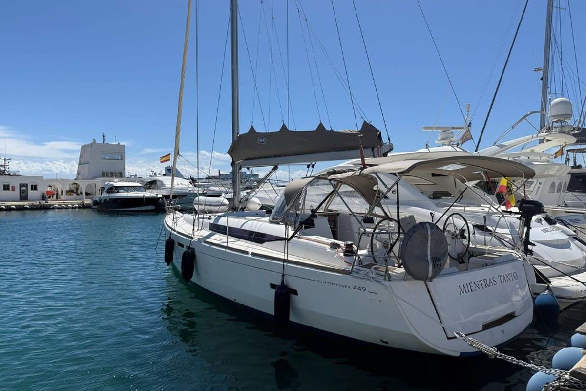 Exterior view of Mientras Tanto, a Jeanneau Sun Odyssey 449 sailboat at Ibiza, Spain